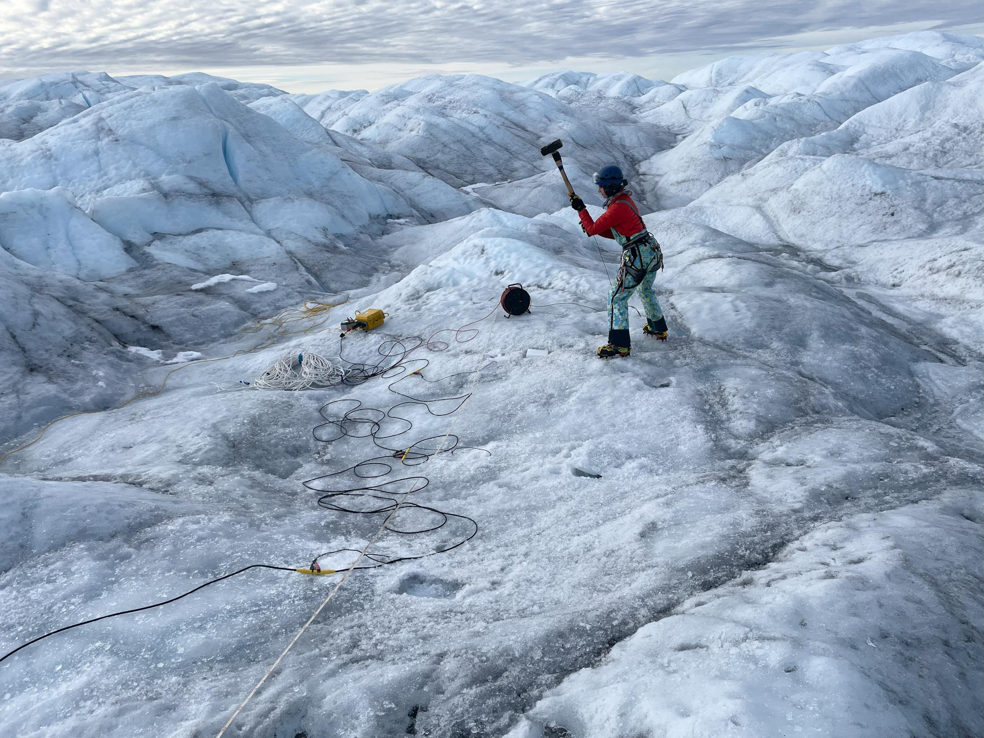 Lisa performing one of many hammer strikes to collect a seismic shot gather. (Photo: Remy Veness)